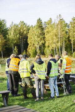 Sweden, Uppland, Rison, Volunteers helping emergency services find missing people