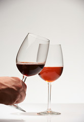 Hand hold red wine glass