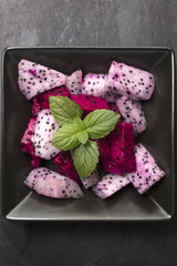 White and Red Dragon Fruit Salad in a Ceramic Bowl