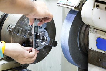 operator grinding and inspection high precision automotive part