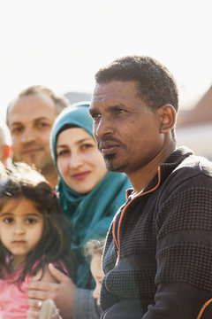 Sweden, Blekinge, Solvesborg, Portrait of man wearing cardigan with family in background