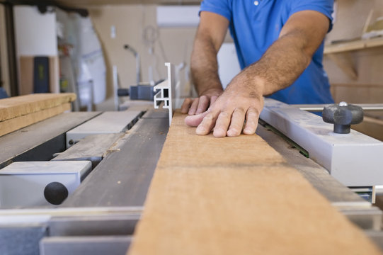 Sweden, Carpenter working with wood