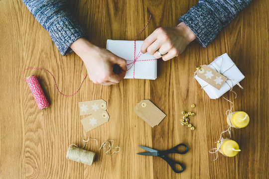 Finland, Man wrapping christmas gifts