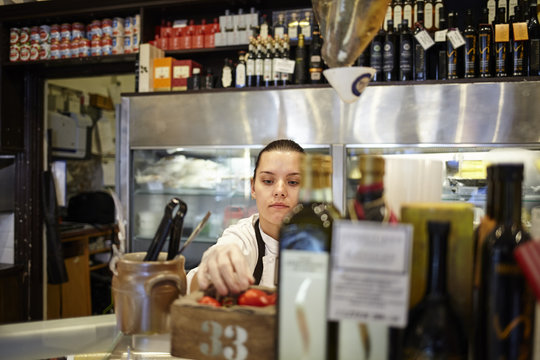 Sweden, Woman working in store