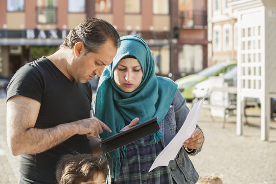 Sweden, Blekinge, Solvesborg, Woman and man using tablet
