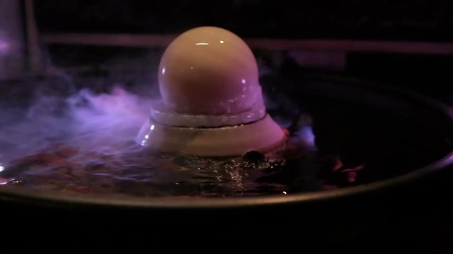 Steaming crystal ball on koi bowl