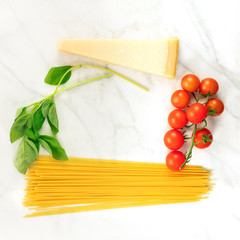 Basic pasta ingredients, including spaghetti and cheese