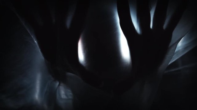 4K Horror Shot Of Hands Silhouette on Plastic Curtain