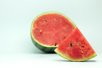 Cut and whole watermelon isolated on white background