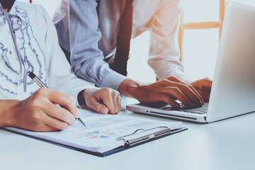 Business team meeting present.professional investor working with new startup project. Finance managers task with laptop computer.