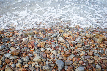 Sea waves crashing to the rocks shore