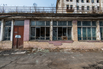 Fototapeta na wymiar Broken windows of an abandoned building