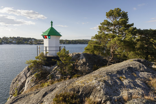 Sweden, Sodermanland, Dalaro, Genbote, Lighthouse on cliff on sunny day
