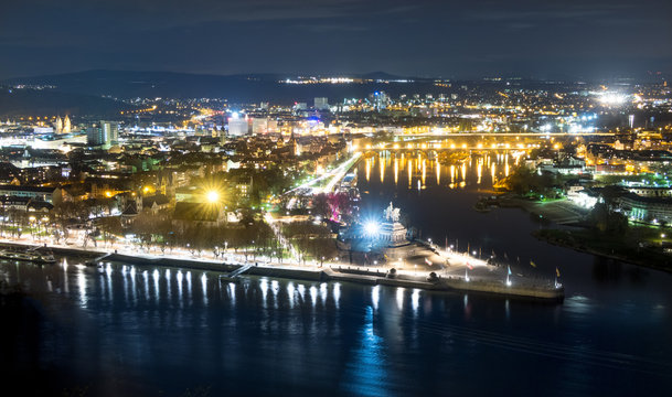 The German Corner (Deutsches Eck) at night at the confluence of Rhine and Mosel rivers in Koblenz with equestrian statue of William I., Germany
