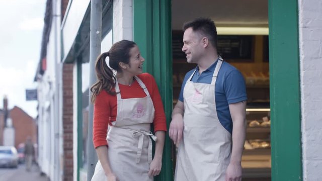  Happy Couple - Small Business Owners Standing Together Outside Bakery Shop