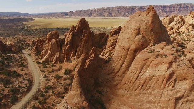 Slowly moving footage over red rock spires