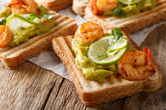 Toast With Guacamole And Shrimps Close-up. Horizontal