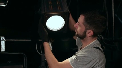 The equipment repair engineer diagnoses the breakdown of light equipment.