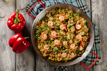 Traditional seafood paella with shrimp, fish and chicken seved i
