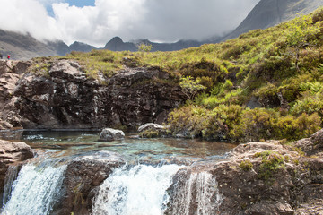 Fototapeta na wymiar Fairy Pools near Glenbrittle at the foot of the Black Cuillin Mountains on the Isle of Skye in the Highlands of Scotland