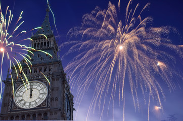 12 O'Clock in Big Ben, Fireworks are displayed on sky to celebrate new year.