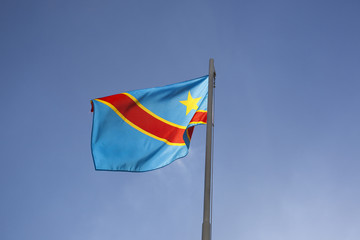 National flag of Congo on a flagpole