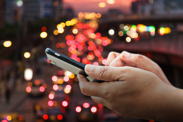 close-up image of male hands using smartphone