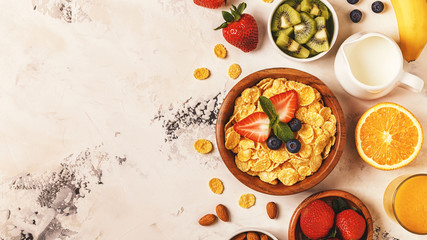 Healthy breakfast - bowl of corn flakes, berries and fruit