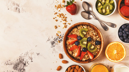 Healthy breakfast - bowl of muesli, berries and fruit