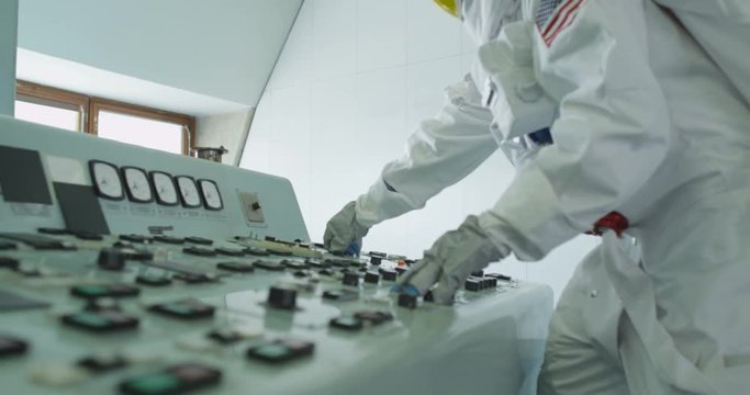  Astronaut in space mission control room, pressing switches & running away
