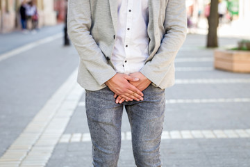 young man prostate problem on walking street