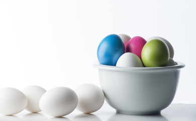 Colored eggs on the white background