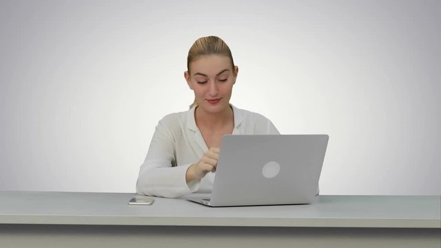 Young secretary tired at work place, yawn on white background.