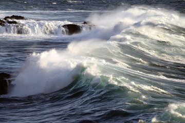 waves breaking in the coast