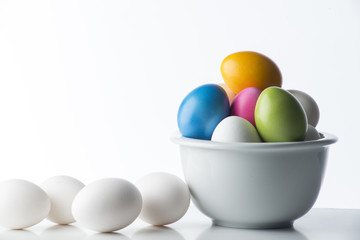Colored eggs on the white background