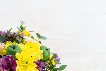 bouquet of flowers on a white wooden background. Copy space