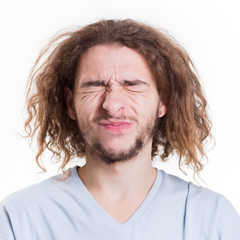 Human basic emotions, man with grimace of disgust
