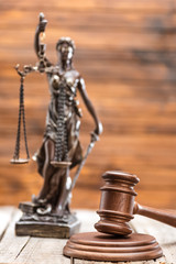 Close-up view of statue of lady justice and mallet, Law concept