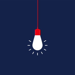 Hanging light bulb on navy background 