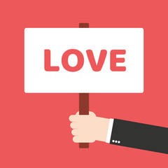 Human hands holding plate with word love