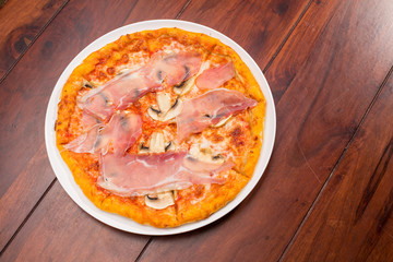 tasty ham and mushroom pizza