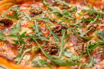 Tasty arugula nuts and blue cheese pizza