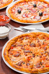 Three pizza suggestion of presentation menu with salmon and sauce