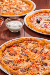 Three pizza suggestion of presentation menu with salmon and sauce
