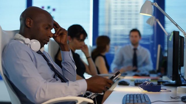  Bored corporate business team in office passing time by chatting