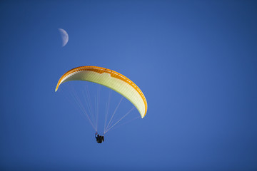 Paraglide silhouette flying.