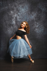 Fototapeta na wymiar Ballet dancer in blue skirt and Ballet Shoes