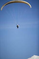 Obraz na płótnie Canvas Paraglide silhouette flying.