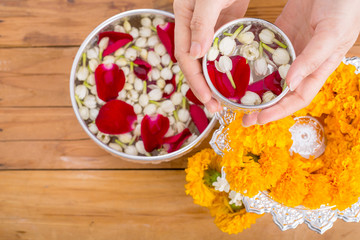 Songkran festival, Thai people prepare water perfume with flower on Thailand New Year.