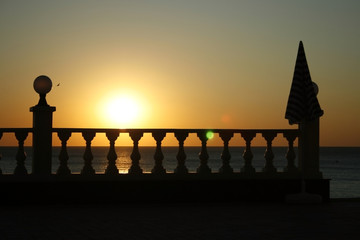 Sunset on the sea and balustrade
